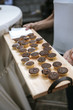 © Alina Schessler - wooden platter with small chocolate cakes