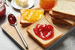 Toast bread with jams on wooden board