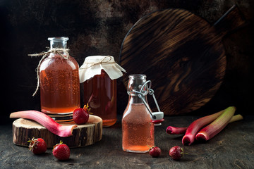 Wall Mural - Homemade fermented strawberry and rhubarb kombucha. Healthy natural probiotic flavored drink. Copy space