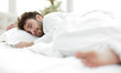 © ASDF - closeup.the tired men sleep soundly on the bed