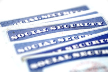Social Security Cards In A Row Pile For Retirement