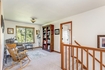 Second floor landing with cozy sitting area.