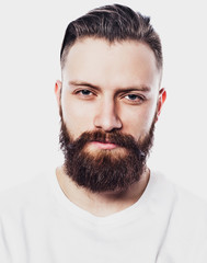 Young bearded man over white background. Lifestyle and people concept.