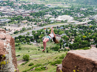 Wall Mural - Girl hanging from highline over Golden, CO