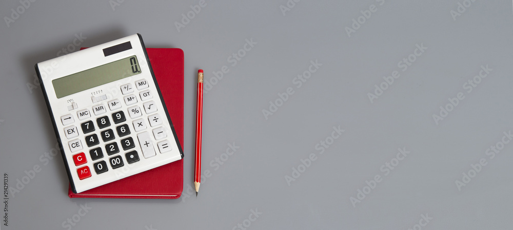 white calculator and red organizer on the grey table with red pencil - obrazy, fototapety, plakaty 