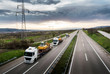 © Ivan - Tow Trucks in a convoy or caravan carrying Construction Machines Excavators along the Highway