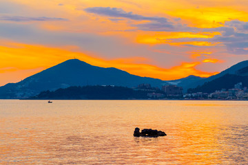  Awesome gold colored sunset on the Adriatic sea coastline in Montenegro, gorgeous seascape