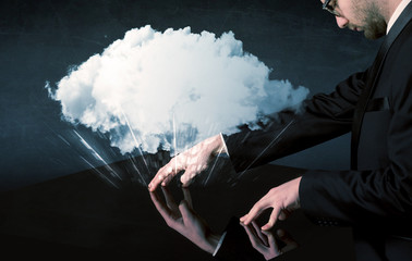Poster - Male hands touching interactive table with a white cloud on it 