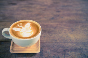 Wall Mural - cup of coffee on wood table