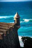 Fototapeta Boho - Watchtower in the iconic Spanish fortress of El Morro guarding the harbor entrance of San Juan, Puerto Rico