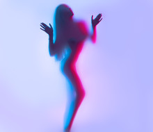 Beauty Model Girl Dancing Silhouette. Beautiful Sexy Young Woman With Perfect Slim Body Dance In Uv Light