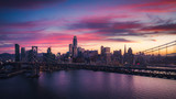 Fototapeta  - Aerial Cityscape view of San Francisco and the Bay Bridge with Colorful Sunset
