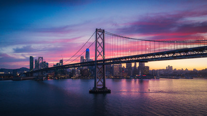 Fototapete - Aerial Cityscape view of San Francisco and the Bay Bridge with Colorful Sunset