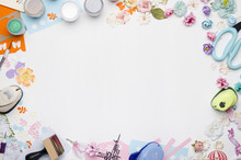 Empty White Space In The Center Surrounded By Paper Flowers, Multi-colored Paper And Scrapbooking Materials. Top View