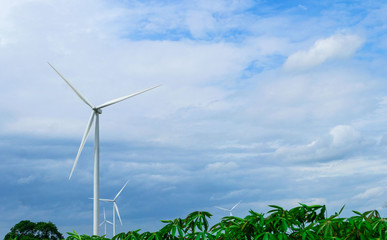 Wind turbines generating electricity on  blue sky background .Eco power .