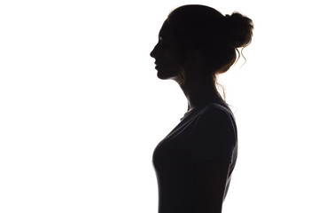 silhouette profile of young woman on a white isolated background