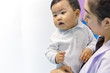 © Yingyaipumi - Pediatrician examines seven months baby, Doctor happy to little boy.