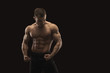 © Prostock-studio - Strong athletic man showes naked muscular body