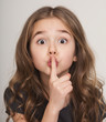 © Prostock-studio - Beautiful little girl with finger on lips f