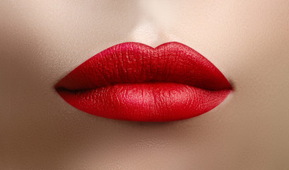 Wall Mural - Cosmetics, makeup. Bright lipstick on lips. Closeup of beautiful