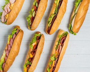 Fresh sub sandwich on white and wheat hoagies.