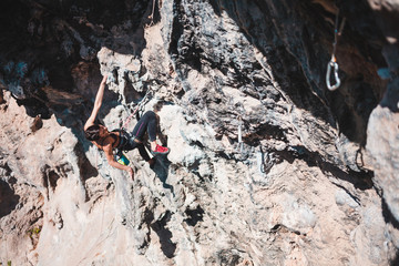 Wall Mural - A climber climbs the rock.