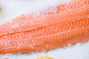 Fresh salmon fillet on ice.