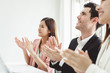 Business people clapping hands during meeting in office for their success in business work