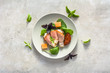 © alicja neumiler - Italian appetizer on table. Antipasti platter or snack food - prosciutto with cheese - lunch on plate