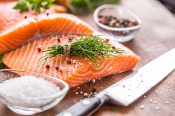 Raw salmon fillet with dill lemon olive oil salt and pepper