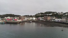 Flying Towards Oban Town And Harbour