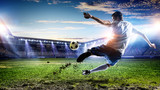 Fototapeta Sport - Soccer player at stadium. Mixed media