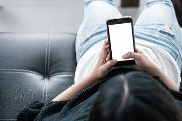 blank screen smartphone mock up.woman holding mobile phone with blank screen for insert graphic objects.chatting message with device.