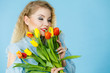 © Voyagerix - Pretty woman with red yellow tulips bunch