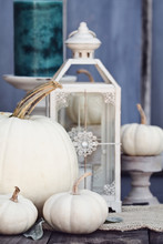 Autumn Decorations With Heirloom Mini And Large White Pumpkins And Candles Against A Rustic Autumn Background. Thanksgiving Day Or Halloween Decor.