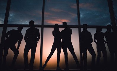 Wall Mural - group of young people in the background of a large window