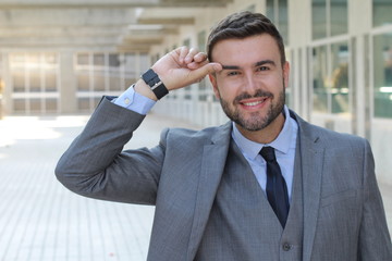 Wall Mural - Man smiling while touch his eyebrow 