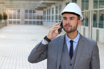 Poster - Engineer with white helmet calling by phone