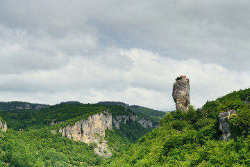 Georgia, Katskhi pillar. Man's monastery near the village of Katskhi. The orthodox church and the abbot cell on a rocky cliff.