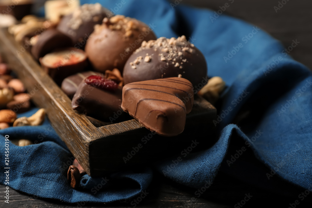 Yummy chocolate candies on tray