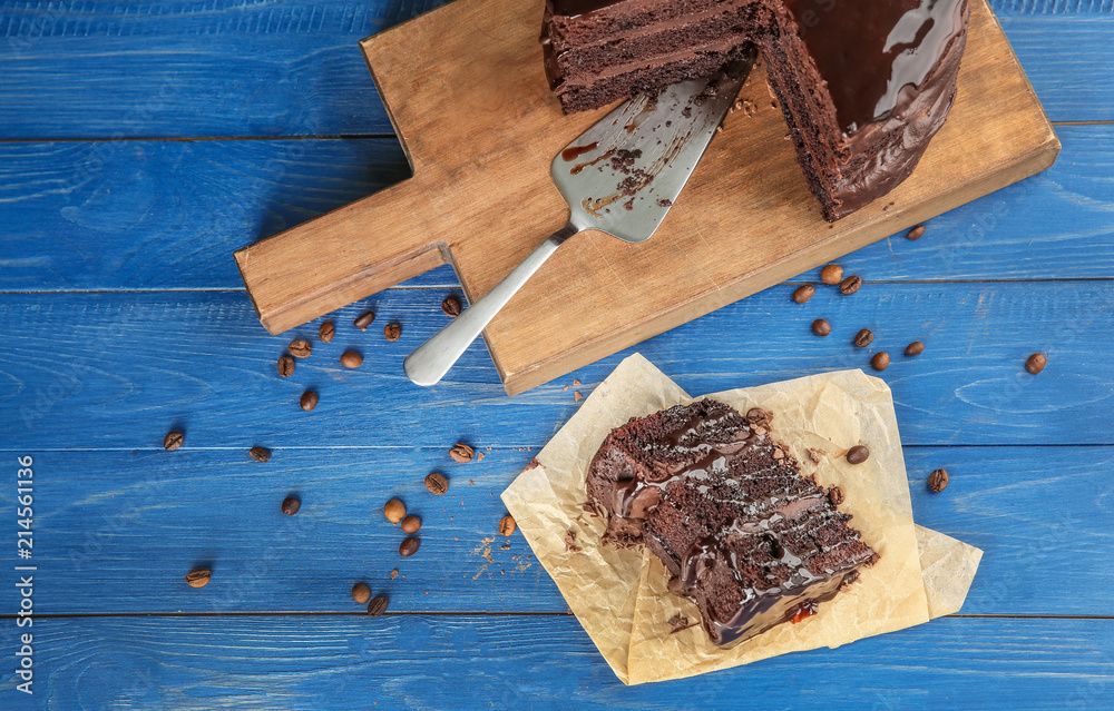 Composition with tasty chocolate cake on wooden table