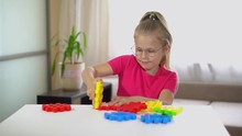 Children's Multicolor Plastic Designer. Puzzle. Beautiful Little Girl Builds A House Of Designer Of Miniland Grandote Activity. Toys And Development: Creativity And Intellectual Games
