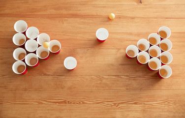 Wall Mural - Cups and balls for beer pong on wooden table