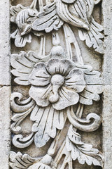 Wall Mural - Traditional balinese stone carving, wall in temple