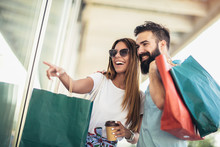 Beautiful Couple Enjoy Shopping Together, Young Couple Holding Shopping Bags