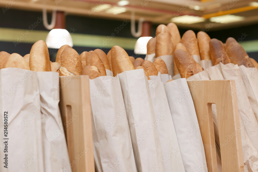 Tasty fresh baguettes in bakery