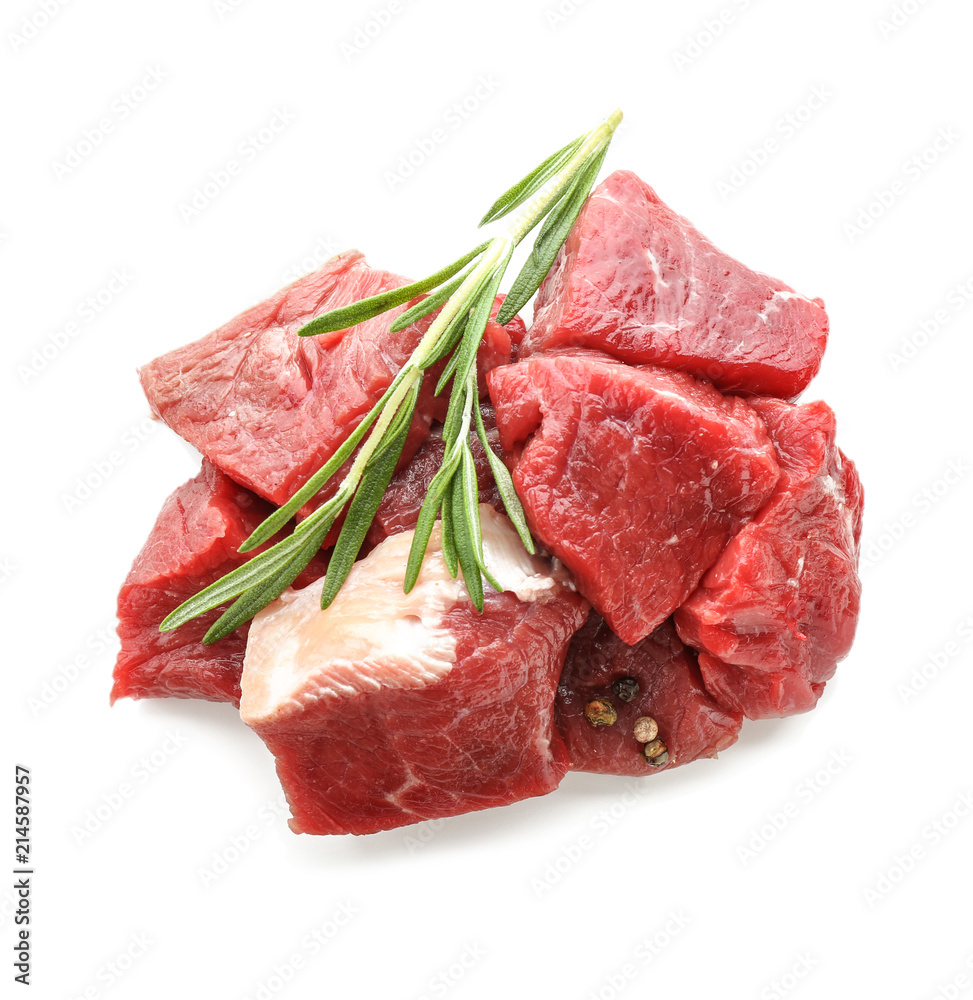 Pieces of raw meat with spices on white background