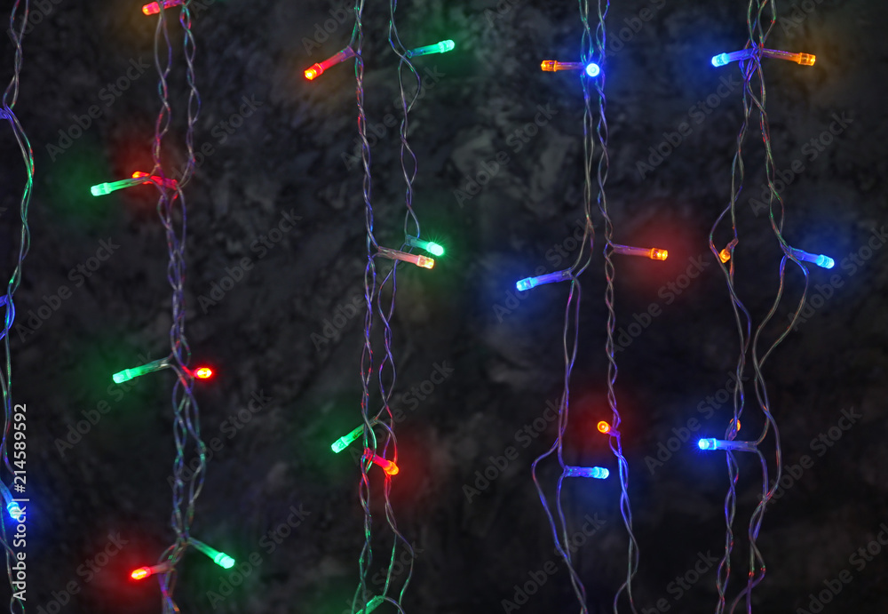Glowing Christmas garland on dark background