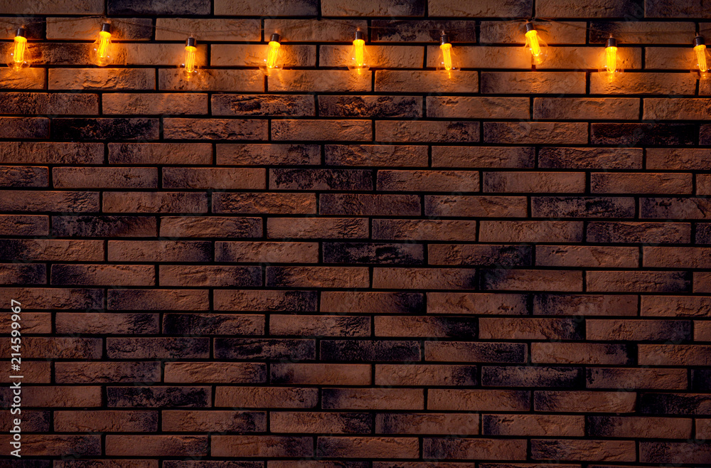 Festive Christmas garland on brick wall