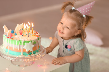 Wall Mural - Cute little girl with birthday cake in room